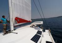 crew on deck of sailing yacht multihull